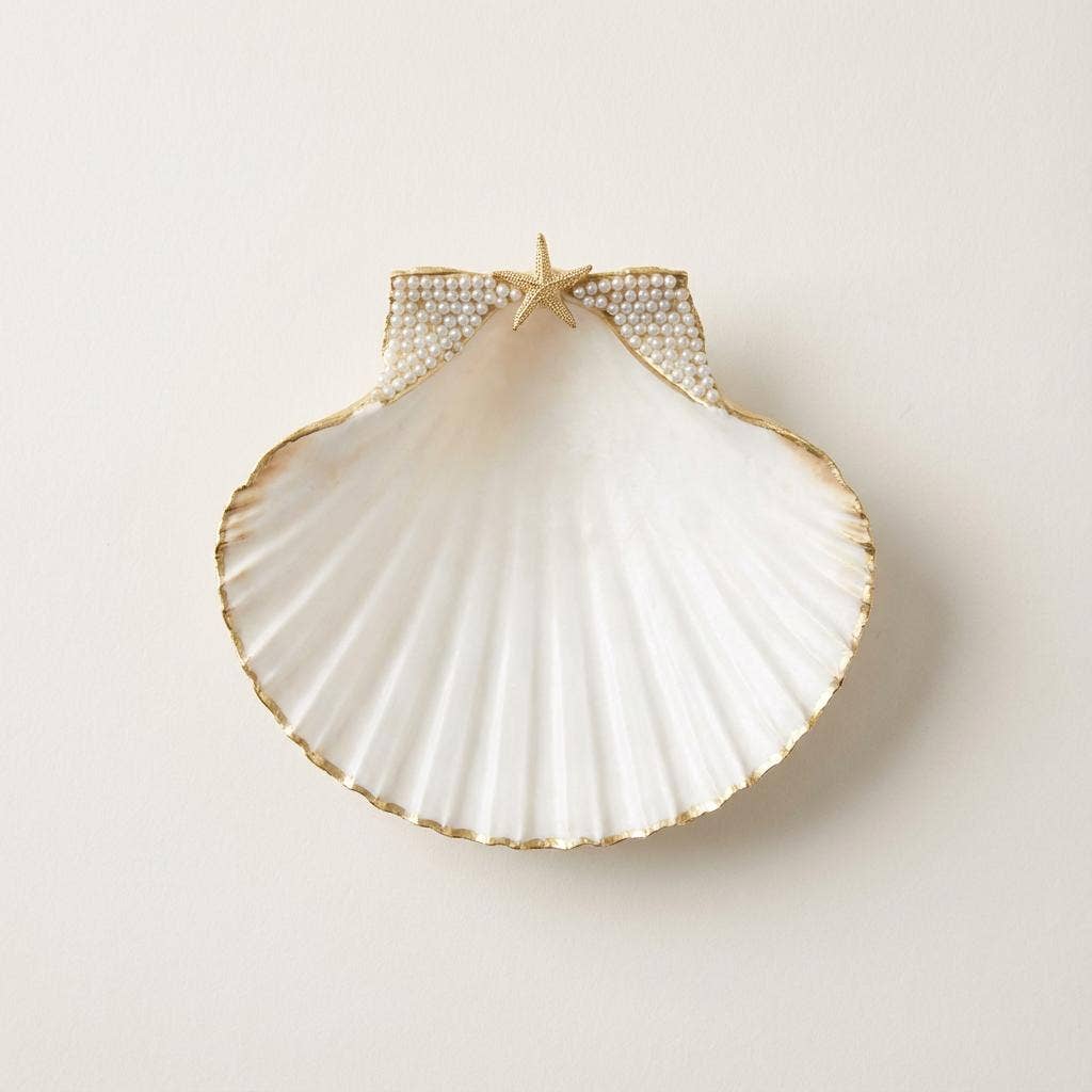 Pearl-accented scallop shell dish in glam coastal style