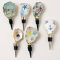 Case pack of 12 neutral tone oyster shell wine stoppers for wholesale