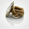 Set of oyster shell napkin rings with jute accent in coastal style