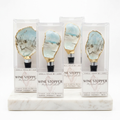 Neutral tone oyster shell wine stopper with gold rim finish