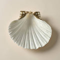 Scallop shell trinket dish with pearl and starry accents in glam style