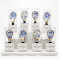 Blue and white toile pattern oyster shell wine stopper with gold finish